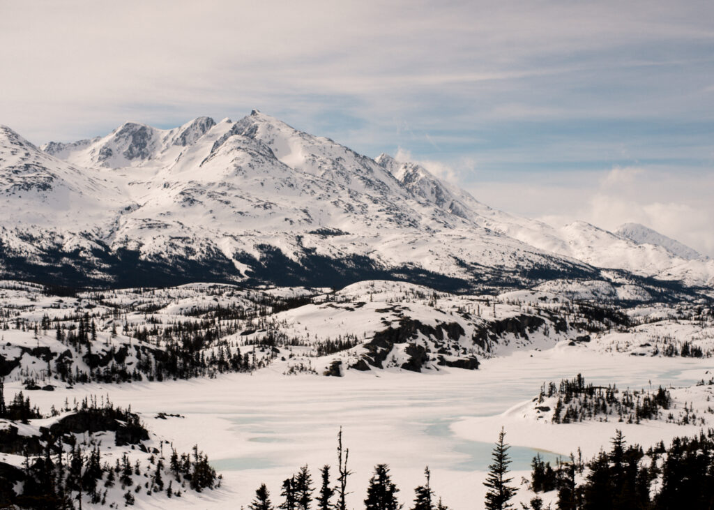 Alaska elopement photographer capturing a couple at golden hour in the Alaskan wilderness